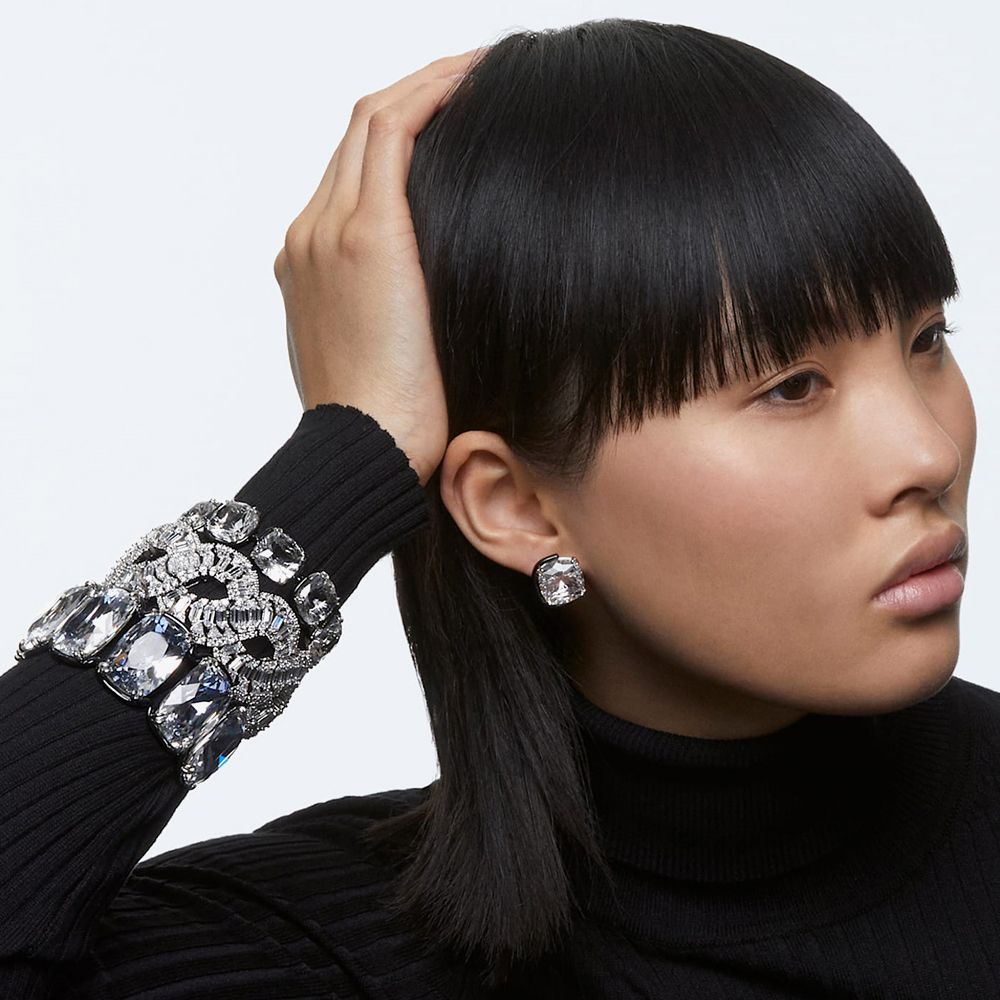 Swarovski Harmonia Stud Earrings worn by a model with the matching Harmonia Bracelets