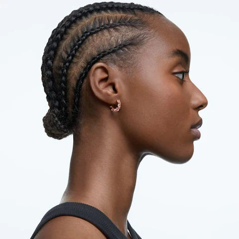 Swarovski rose gold hoop earrings worn by a model