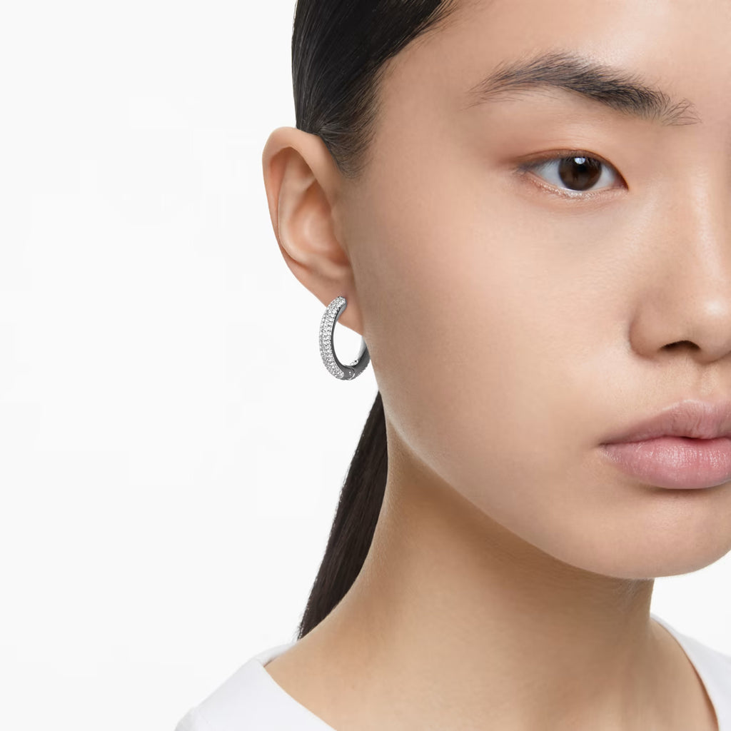 Swarovski Dextera hoop earrings worn by an asian model.