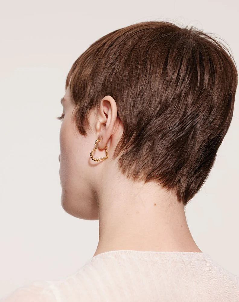 Meadowlark Fizzy Heart Hoop Earrings, worn by a model