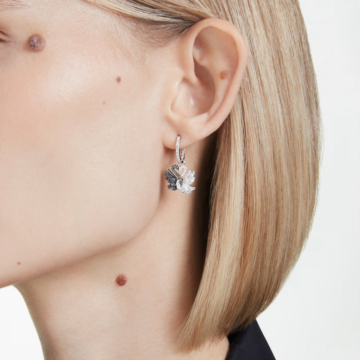 Swarovski Swan earrings, rhodium and ruthenium plated detail