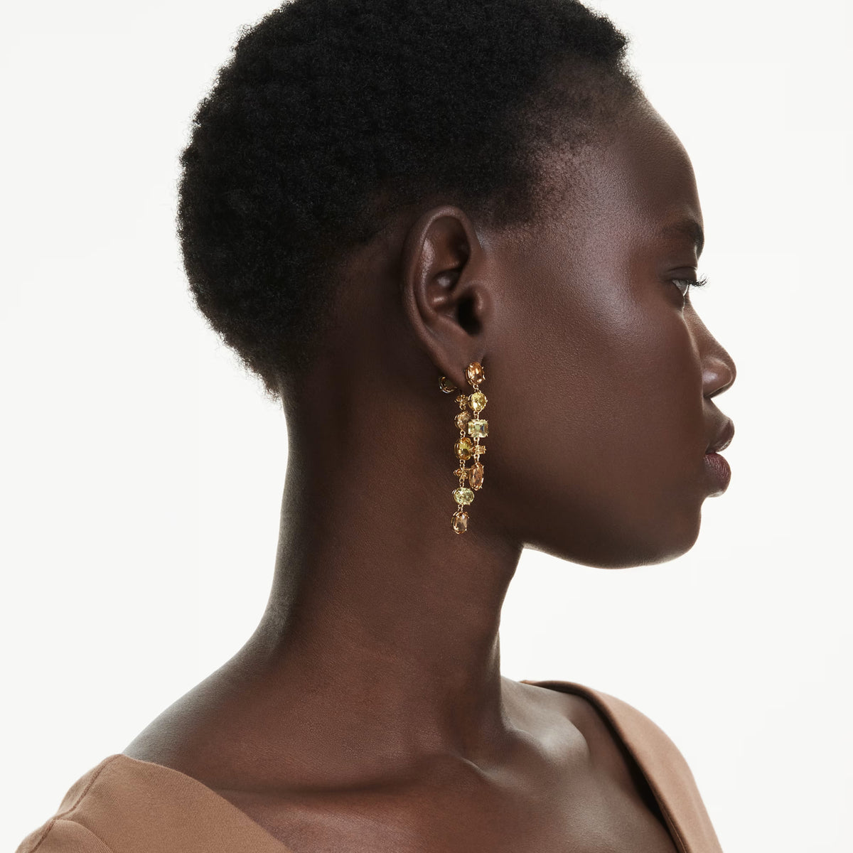 Swarovski Gema drop earrings, 18K gold-finish asymmetrical design in yellow and amber tones