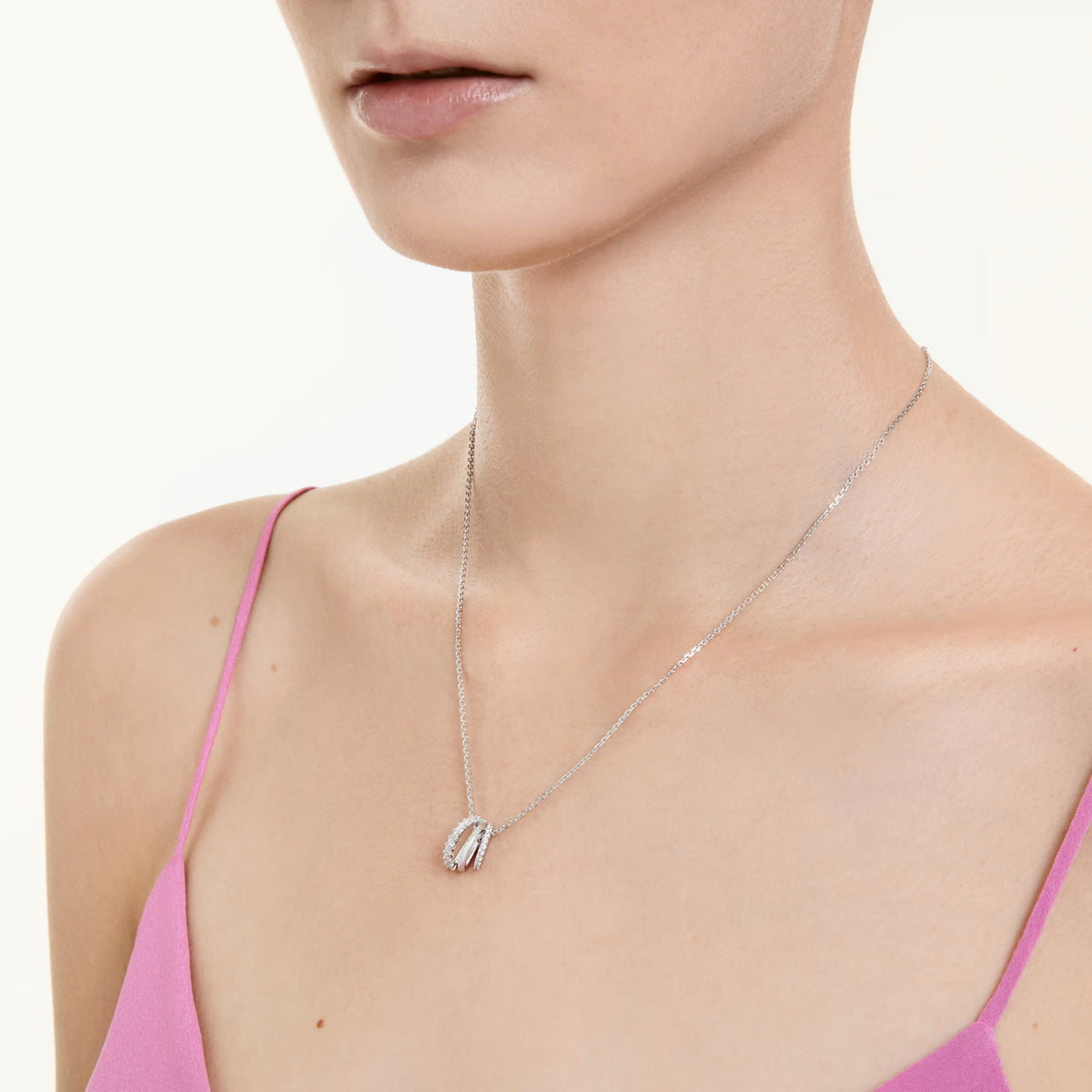 Swarovski Hyperbola pendant, rhodium-plated triple hoop design with crystal accents