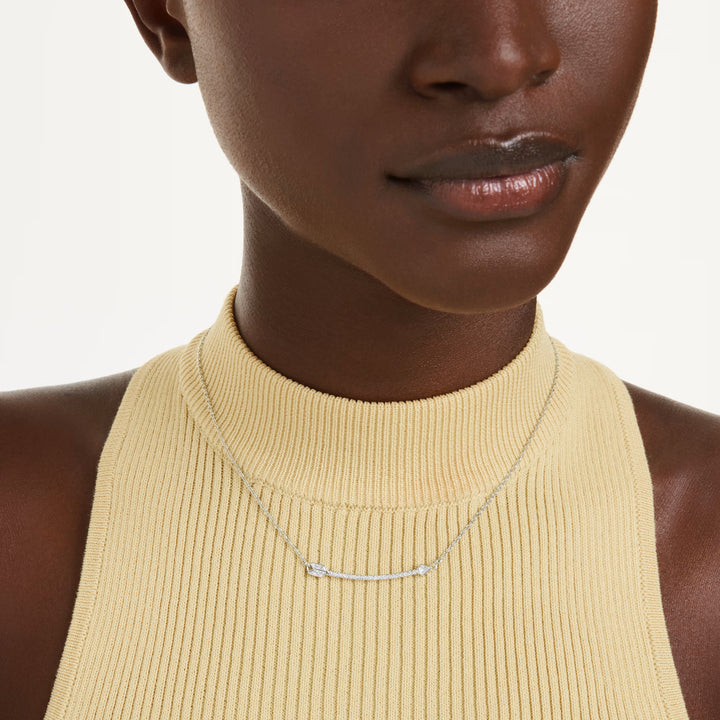 Swarovski Idyllia pendant, rhodium-plated arrow silhouette with clear round crystals