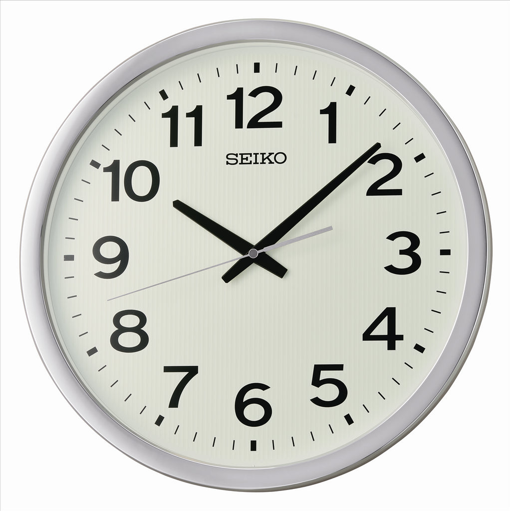 White Seiko wall clock with a glow in the dark dial