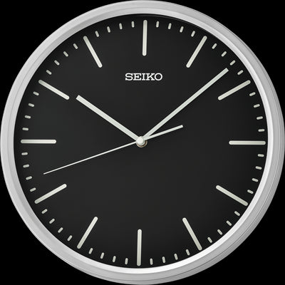 Seiko wall clock with a black dial