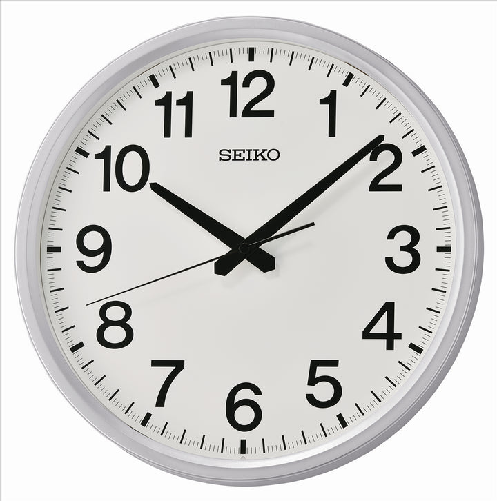 White Seiko wall clock with black numbers and black hands