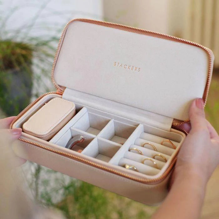 Large blush pink travel jewellery case with compartments for rings, earrings, and necklaces