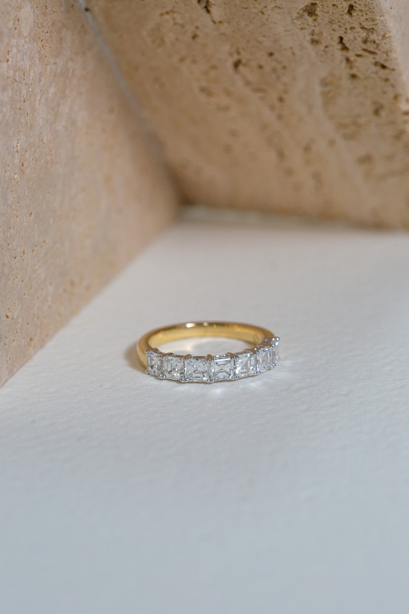 Asscher cut diamond ring, set on a yellow gold band.