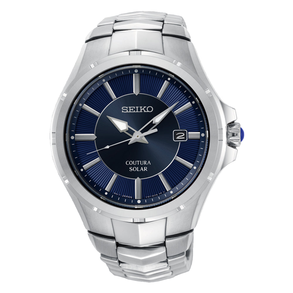 Seiko Coutura men’s solar-powered watch with dark blue dial and stainless steel bracelet worn in a stylish everyday setting – elegant, sustainable timepiece for modern professionals.